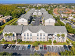 Aerial view of Miramar Apartments in Kissimmee, FL, showcasing 5-bedroom units and outdoor living spaces.
