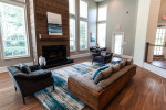 Luxurious apartment interior at Carrington Park featuring a spacious living room with large windows and modern decor.
