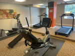 State-of-the-art fitness center with various exercise equipment in a Jacksonville apartment community.