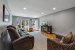 Bright living room in charming Brooklyn single family home with hardwood floors and modern decor.