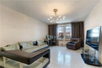 Spacious living room in a 2-bedroom Brooklyn apartment featuring natural light and modern decor.