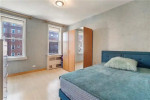 Spacious 2-bedroom apartment in Homecrest, Brooklyn, featuring large windows and modern decor.