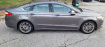 2013 Ford Fusion Titanium AWD sedan in great condition with alloy wheels and hybrid badge