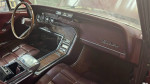 Interior view of a 1966 Ford Thunderbird with leather seats and vintage dashboard details.