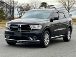 2016 Dodge Durango SXT RWD parked, featuring a clean exterior and well-maintained tires.