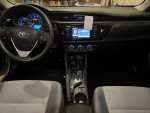 Interior view of a 2016 Toyota Corolla with modern dashboard and control features