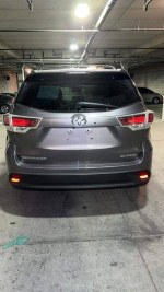 2015 Toyota Highlander XLE FWD rear view in Alumina Jade Metallic, fully loaded with features