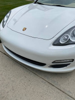 Close-up view of the front bumper of a 2011 Porsche Panamera in pristine condition