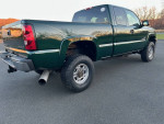 Green Chevrolet truck with a clean exterior and new parts, emphasizing its low mileage and maintenance history.