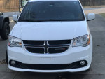 2019 Dodge Grand Caravan minivan with wheelchair lift, white exterior and black interior, parked outside