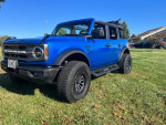 2022 Ford Bronco Big Bend 4WD with new tires and lift kit parked on grass