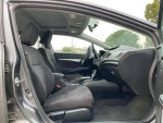 Interior view of a Honda Civic showing front seats and dashboard, clean with modern features.
