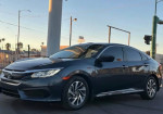 2020 Honda Civic in dark color, showcasing modern design with moon roof and backup camera.