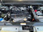 Engine compartment of a 2010 Kia Soul showing its 2L I4 engine and components.
