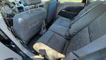 Interior view of a 2006 Chrysler PT Cruiser showing gray upholstery and rear seating.