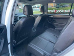 Interior view of a 2018 Volkswagen Tiguan S with spacious back seats and modern features.