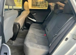 Interior view of a 2012 Toyota Prius Four showing spacious backseat with clean upholstery.