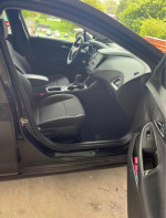 Interior view of a 2014 Chevrolet Cruze 1LT showing clean seats and dashboard in good condition