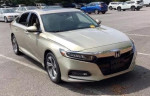 2019 Honda Accord Sport in gold color, parked, featuring a clean design and modern aesthetic.