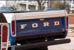 Rear view of a 1991 Ford F-250 XL truck showcasing its blue and white design.