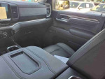 Interior view of the 2022 Chevrolet Silverado 1500 Limited Custom Trail Boss showing black leather seats and dashboard.