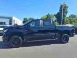 2022 Chevrolet Silverado 1500 Limited Custom Trail Boss in black, showcasing its sleek exterior and rugged design.