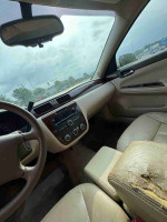 Interior view of a 2012 Chevrolet Impala with leather seats and dashboard controls.
