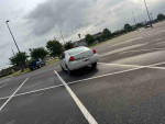2012 Chevrolet Impala LS parked in a spacious lot, offering reliability and comfort for daily driving.