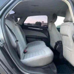 Interior view of 2015 Ford Fusion showcasing clean and spacious back seat area.