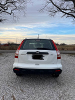 Rear view of a 2009 Honda CRV parked outdoors, showing clean exterior and no visible damage.
