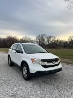 2009 Honda CRV for sale with 230,000 miles, clean condition, new tires and battery, reliable vehicle.