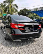 Black 2018 Honda Accord Sport parked outdoors, showcasing its clean exterior and tinted windows.