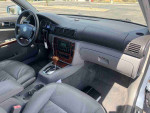Interior view of a 2003 Volkswagen Passat GLX showcasing leather seats, dashboard, and audio system.