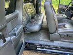 Interior view of a 2003 Chevrolet Silverado 1500 SS showing rear seating and spacious cabin design.