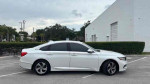 Side view of a white 2018 Honda Accord EX-L, showcasing its sleek design and modern styling.