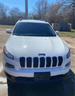 Front view of a 2015 Jeep Cherokee Altitude for sale, showing a clean white exterior and distinctive grille.