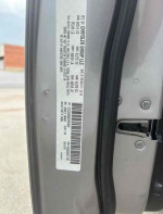 VIN label of a well-maintained 2014 Dodge Charger R/T with great gas mileage for sale.