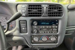 Interior controls of a 2003 Chevrolet S-10 LS ZR2, showcasing clean dashboard features and radio system.