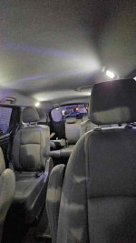 Interior view of a 2018 Honda Odyssey LX showcasing spacious seating for 7-8 passengers.