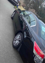 2012 Honda Accord EX-L for sale, 168k miles, black car parked on street with child in background.