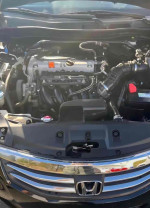 Engine view of a 2012 Honda Accord EX-L with 168,000 miles, showcasing its clean condition and performance features.