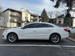 2009 Volkswagen CC Luxury FWD sedan in white parked outside, featuring tinted windows and clean exterior.