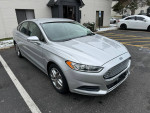 2013 Ford Fusion SE FWD in silver color, parked with clean body and interior, showcasing sleek design.