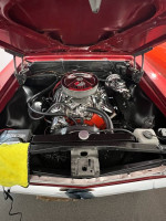 Under the hood of a 1969 Chevrolet Camaro SS showcasing the polished engine components.