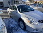 2010 Nissan Altima in great condition with 66,000 miles, featuring a sunroof and new battery.