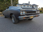 1968 Plymouth GTX 440 with custom paint, showcasing a powerful design and classic muscle car features.