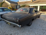 1968 Plymouth GTX 440 with RatRod paint, stored in garage, showing rear view.