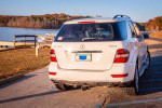 2010 Mercedes-Benz ML-350 parked by the lake, showcasing its premium features and recent maintenance.
