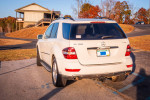2010 Mercedes-Benz ML-350 parked, showing trailer hitch and rear view in a scenic location.