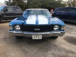 Front view of a 1972 Chevrolet Chevelle convertible in blue metallic color with racing stripes.